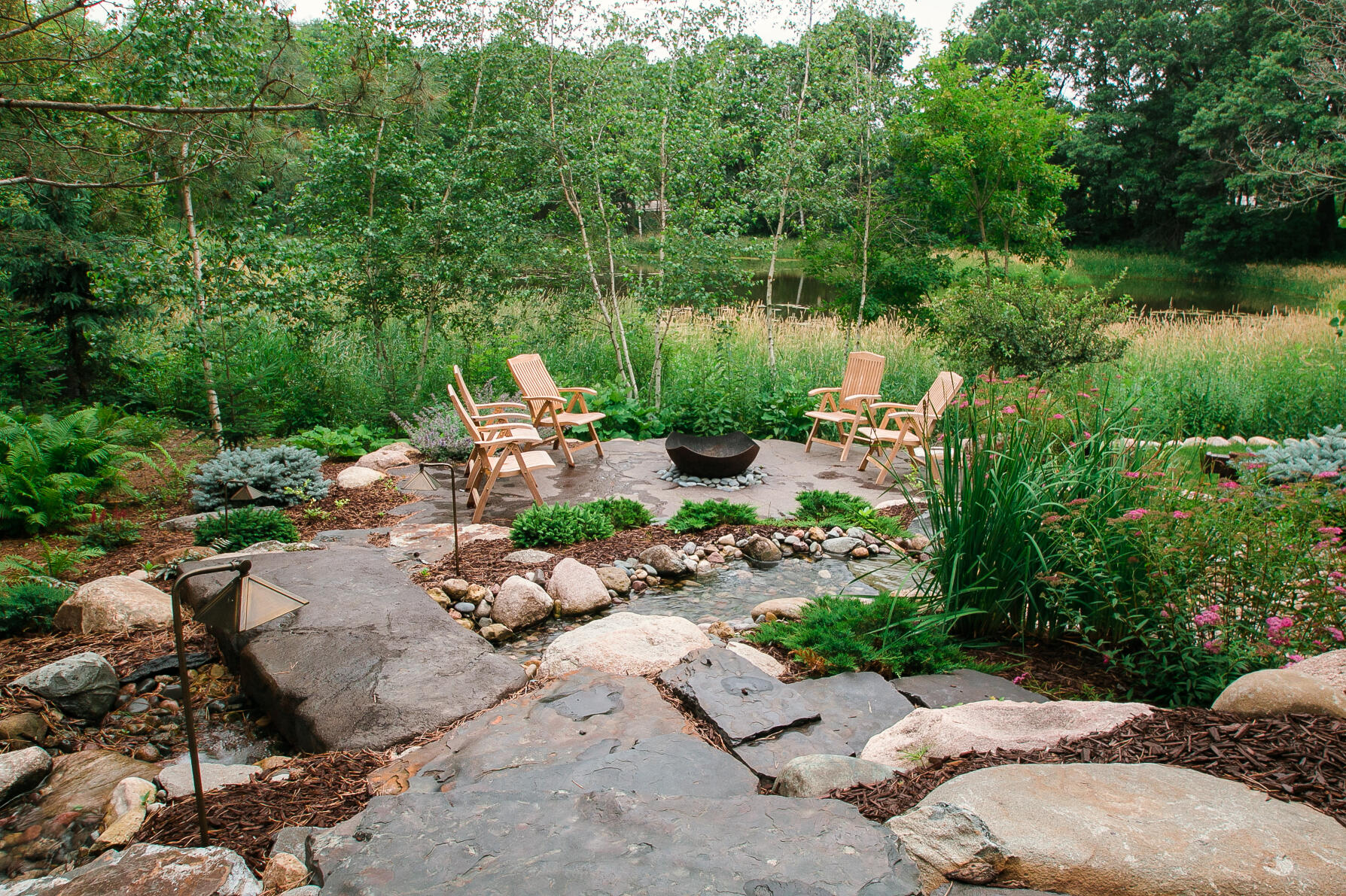 stone patio with water fall feature